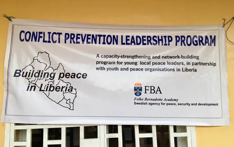 Banner saying Building peace in Liberia.