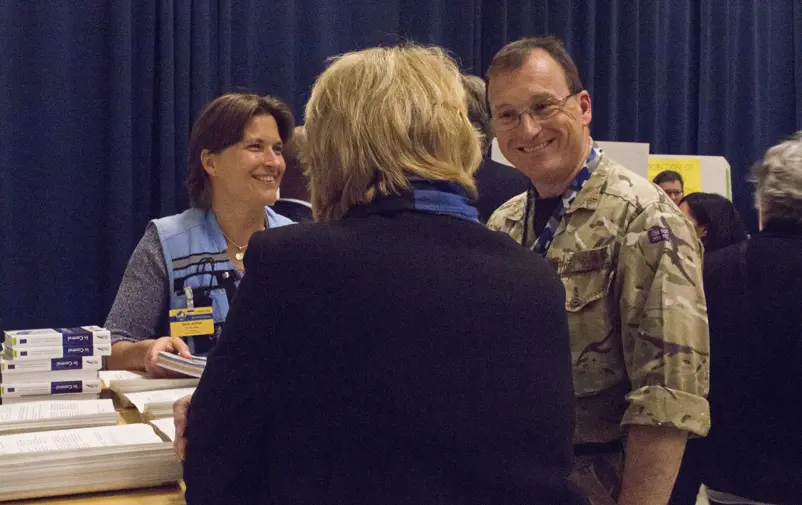 Participants from civilian and military organizations interact.