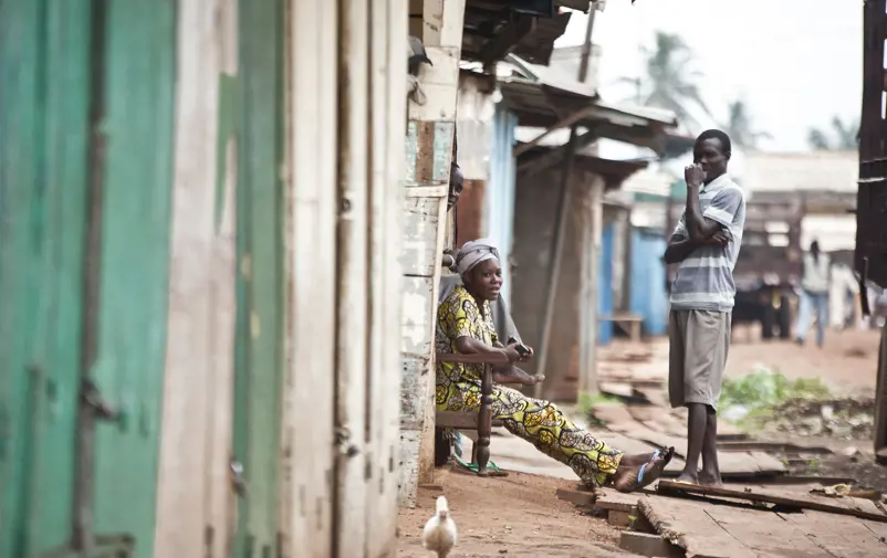 A woman and a man on a street.