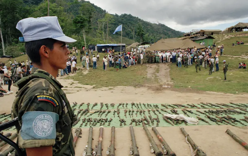 UN personnel at a site for disarmament of ex-combatants. 