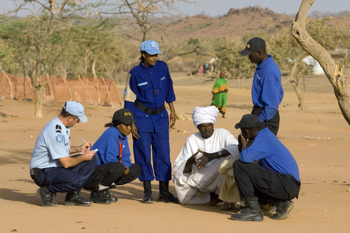 UN Police Officers interviewing refugees.